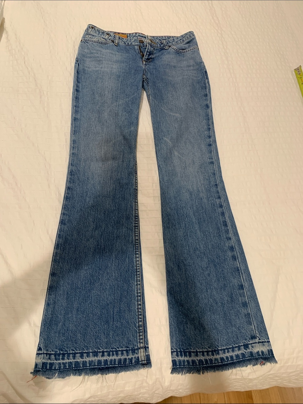 Mid Rise Blue Wide Leg Jeans with Raw Hem